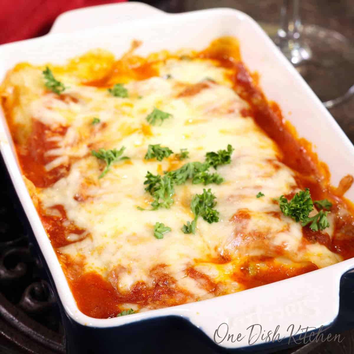 single serving spinach manicotti in a small baking dish.