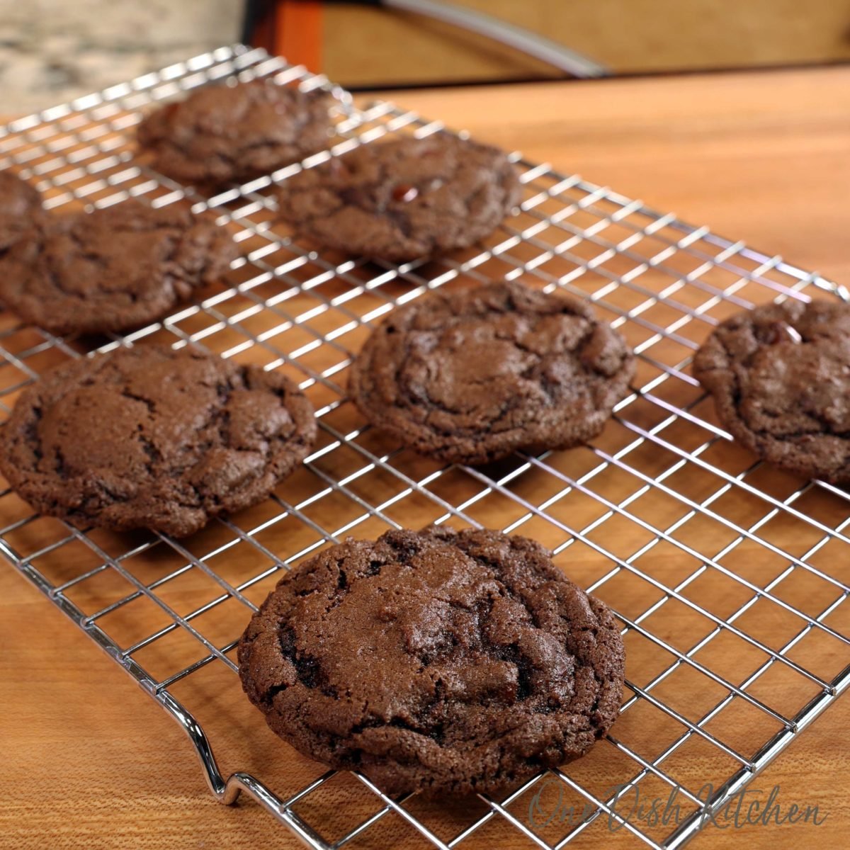 7 chocolate cookies on a cooling rack