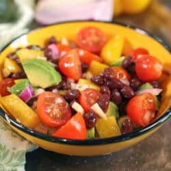guacamole salad in a yellow bowl.