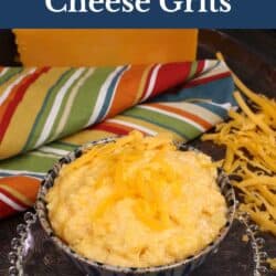a bowl of cheese grits next to a pile of shredded cheddar cheese.