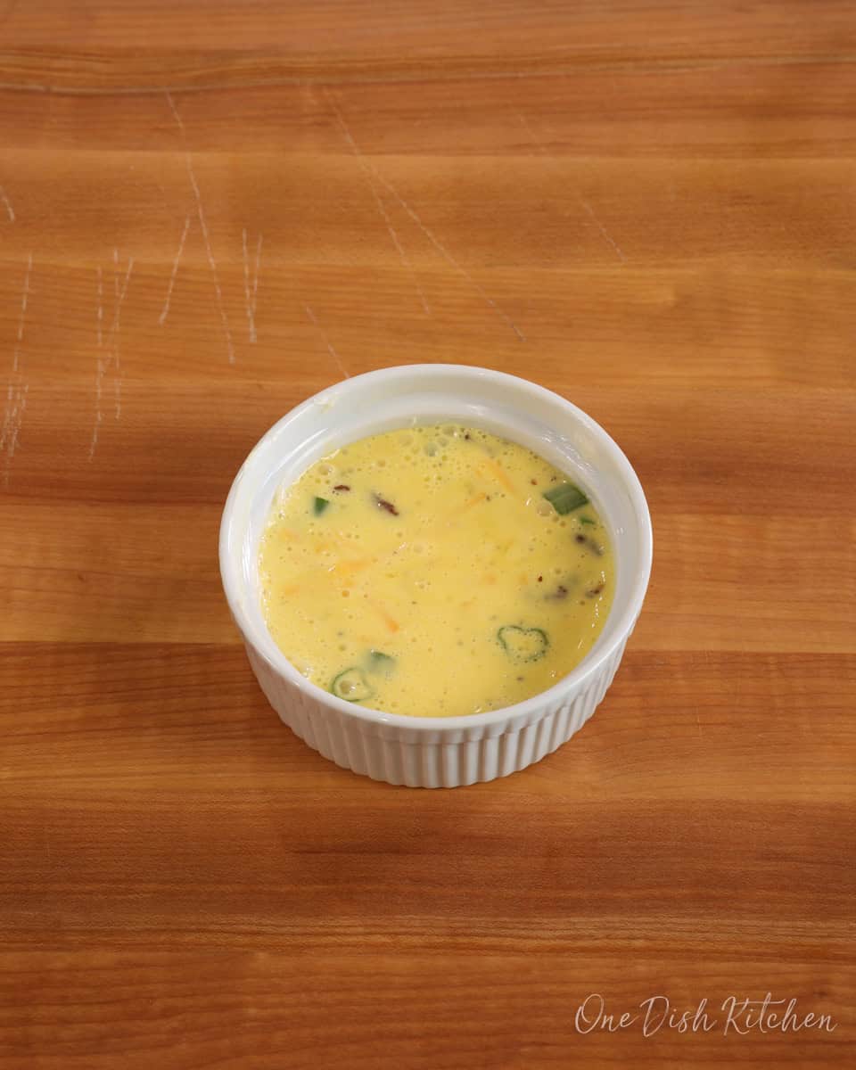 unbaked egg mixture in a ramekin.