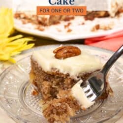 a slice of hummingbird cake on a plate with a fork on the side.