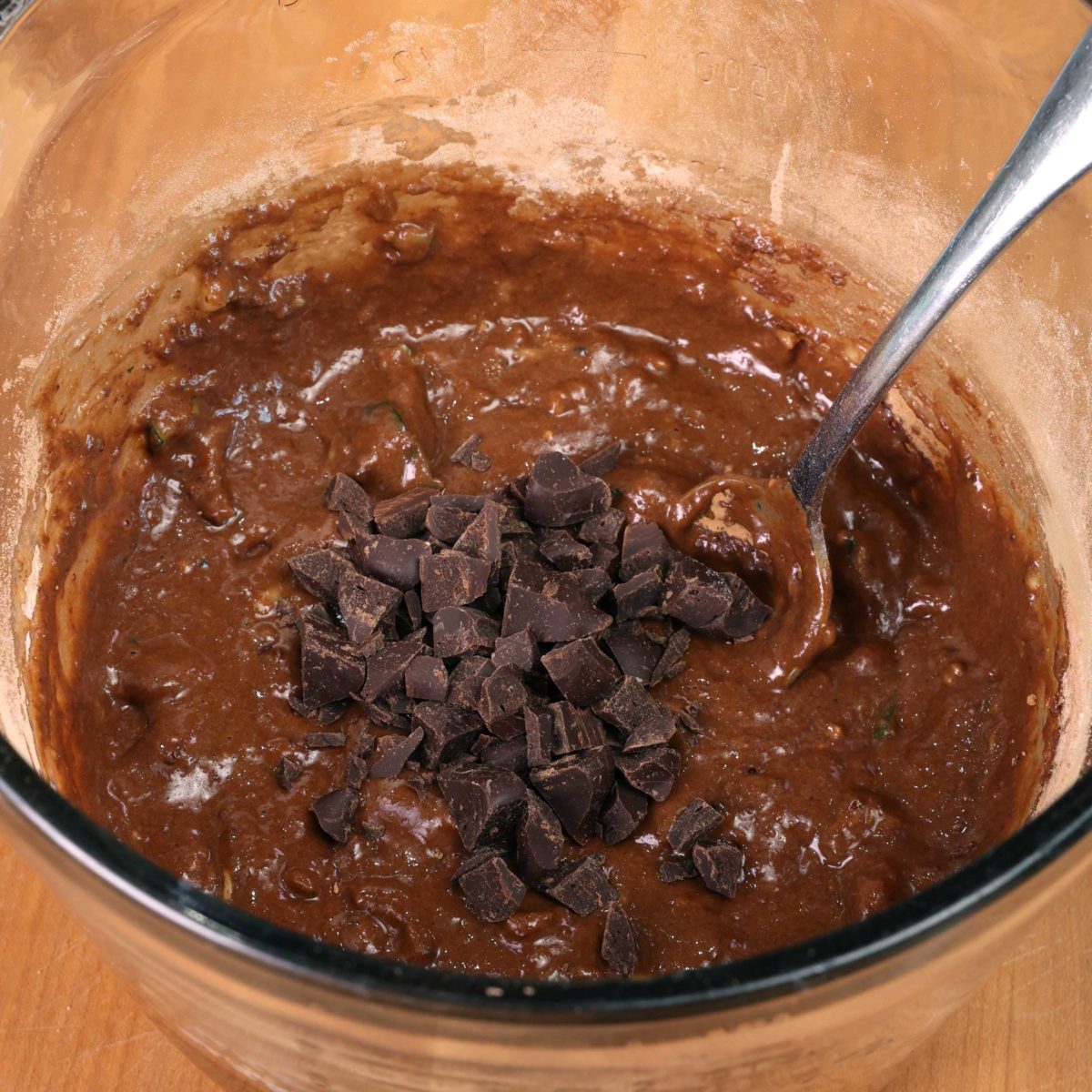 chocolate chips in a mixing bowl with chocolate cake batter.
