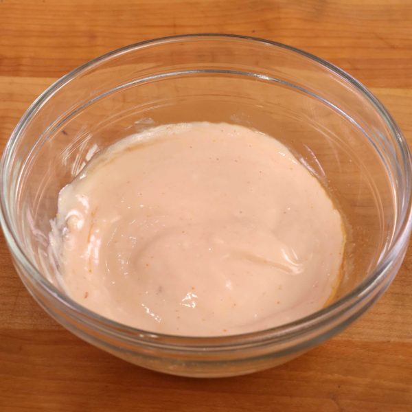 a small clear bowl filled with homemade russian dressing