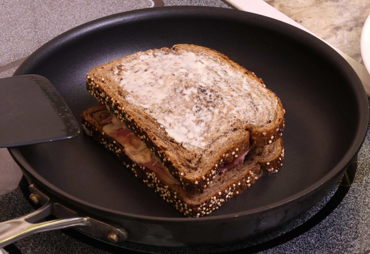 a reuben sandwich in a skillet