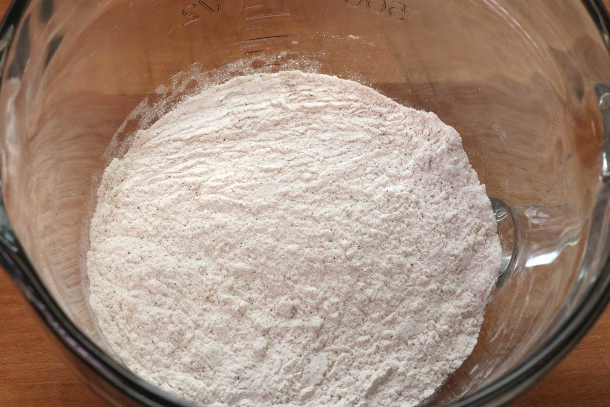flour, cinnamon, baking powder, and baking soda in a mixing bowl.