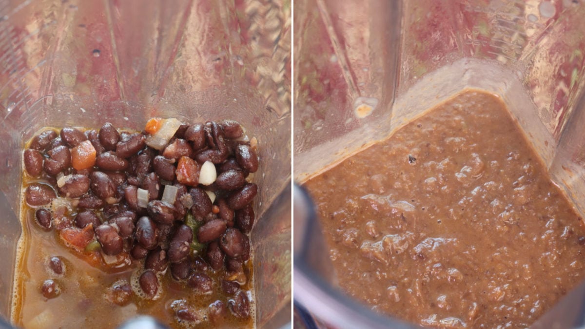 black beans and vegetables in a blender being pureed.