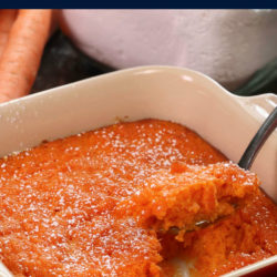 a spoonful of carrot souffle held above the baking dish containing the remainder
