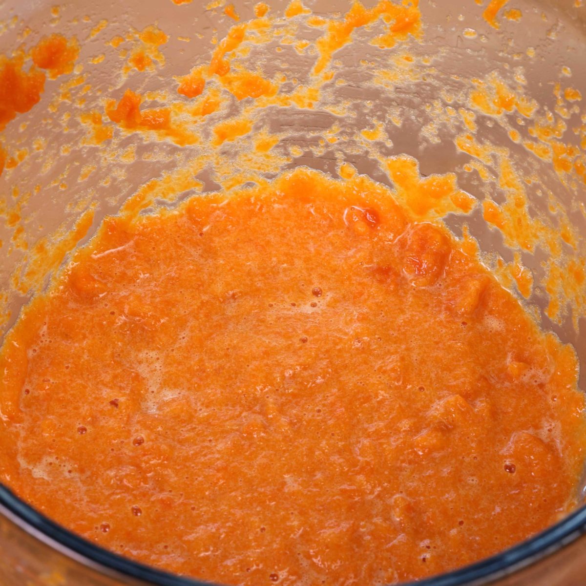 pureed carrots, sugar, egg, baking powder and flour in a mixing bowl.