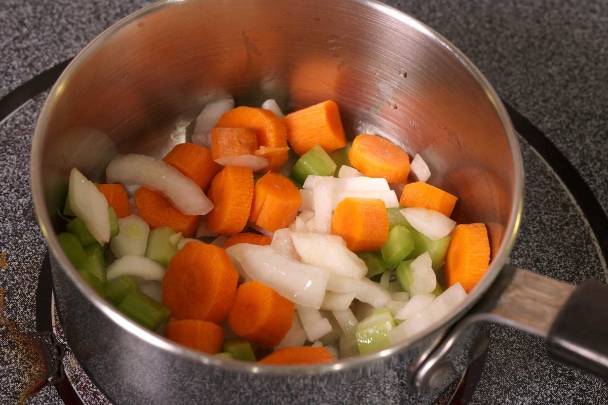 onions, celery, garlic, and carrots in a small pot.