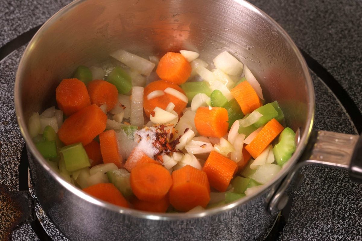 carrots, celery, onions, salt and red pepper flakes in a small pot.
