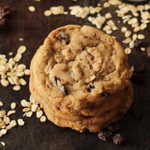 three oatmeal raisin cookies stacked on top of one another.