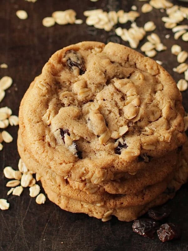 three oatmeal raisin cookies stacked on top of one another.