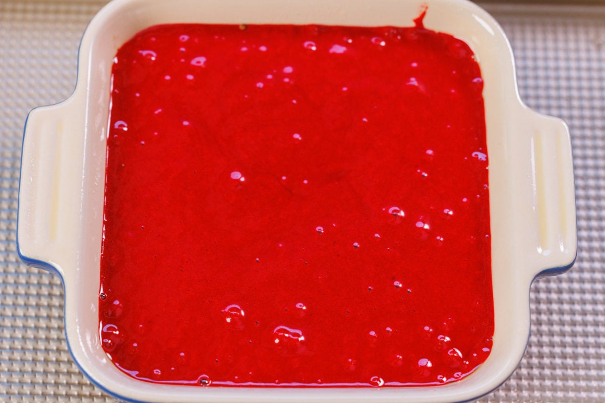 red velvet cake batter in a small baking dish.