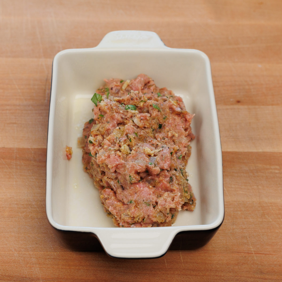 unbaked turkey meatloaf in a small baking dish.