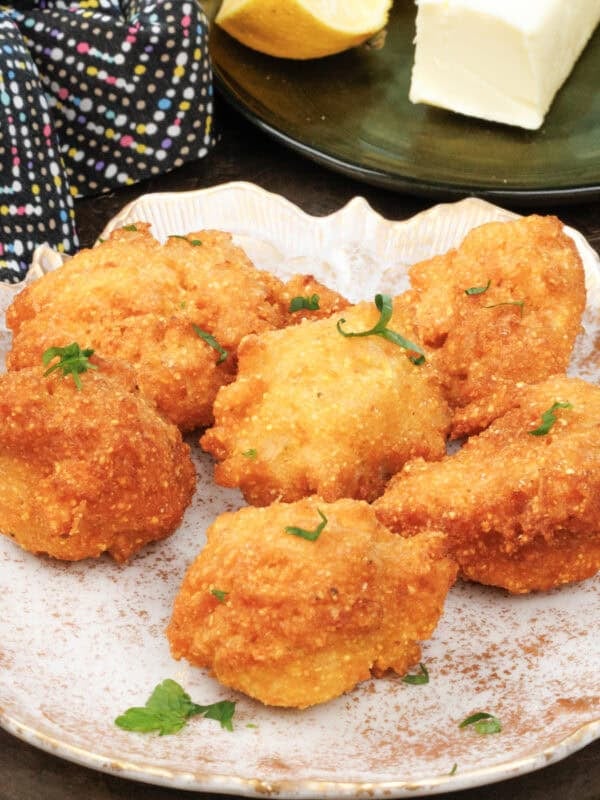 a small batch of hushpuppies on a a plate.