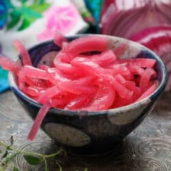 a small batch of pickled onions in a bowl.