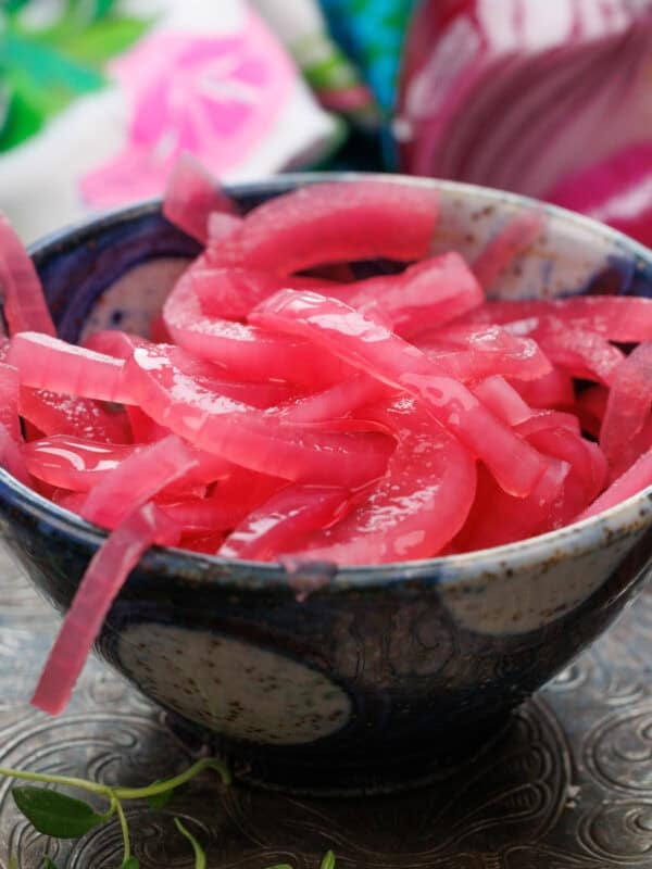 a small batch of pickled onions in a bowl.