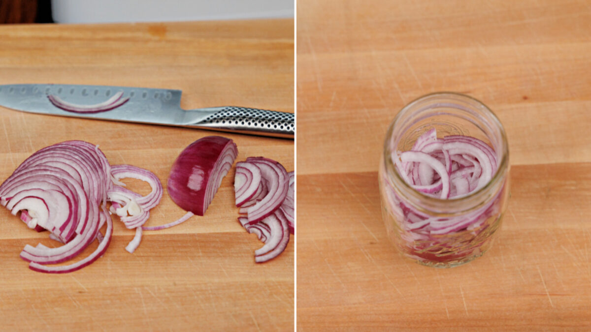 thinly sliced red onions in a mason jar.