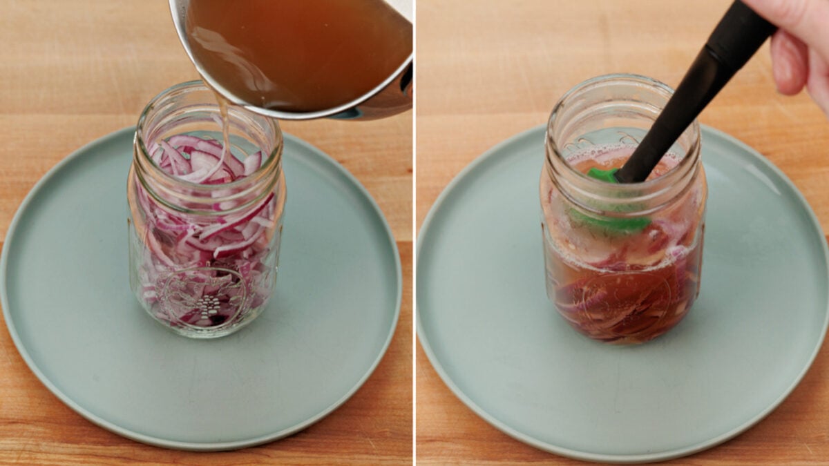 pouring brining liquid over sliced onions in a mason jar.