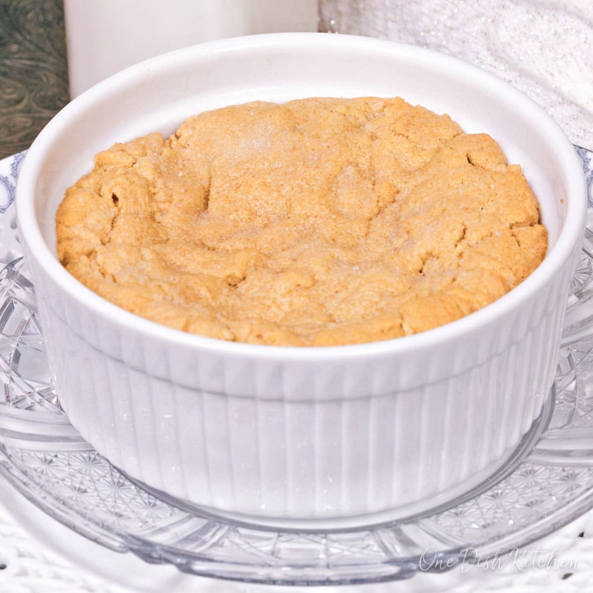 a deep dish peanut butter cookie in a white ramekin.