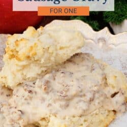 a biscuit cut in half and topped with sausage gravy.