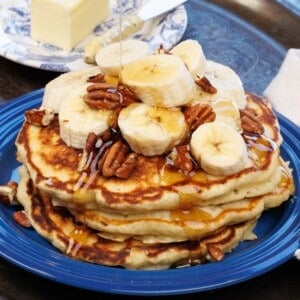 three pancakes topped with bananas