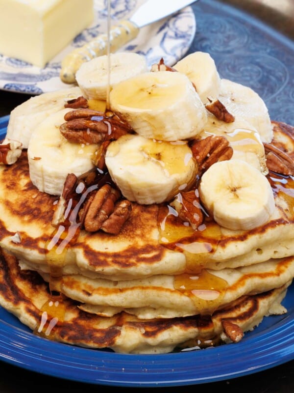 three pancakes topped with bananas