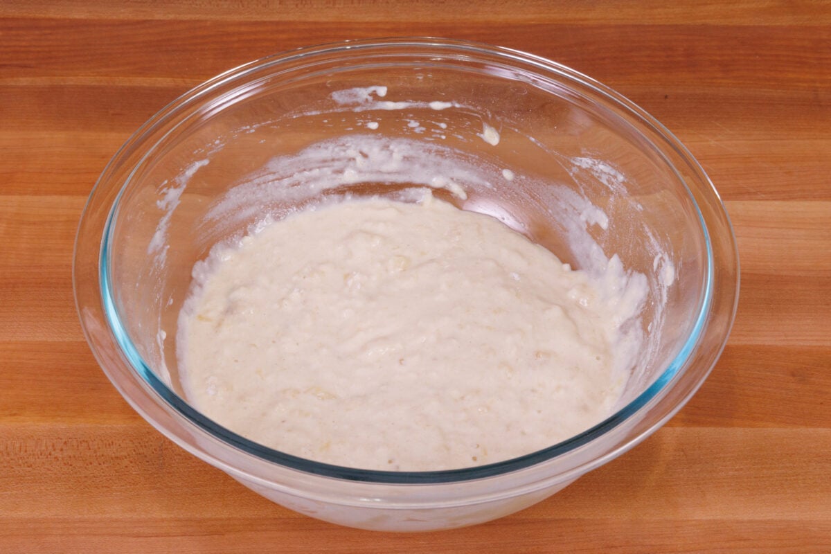 banana pancake batter in a mixing bowl.
