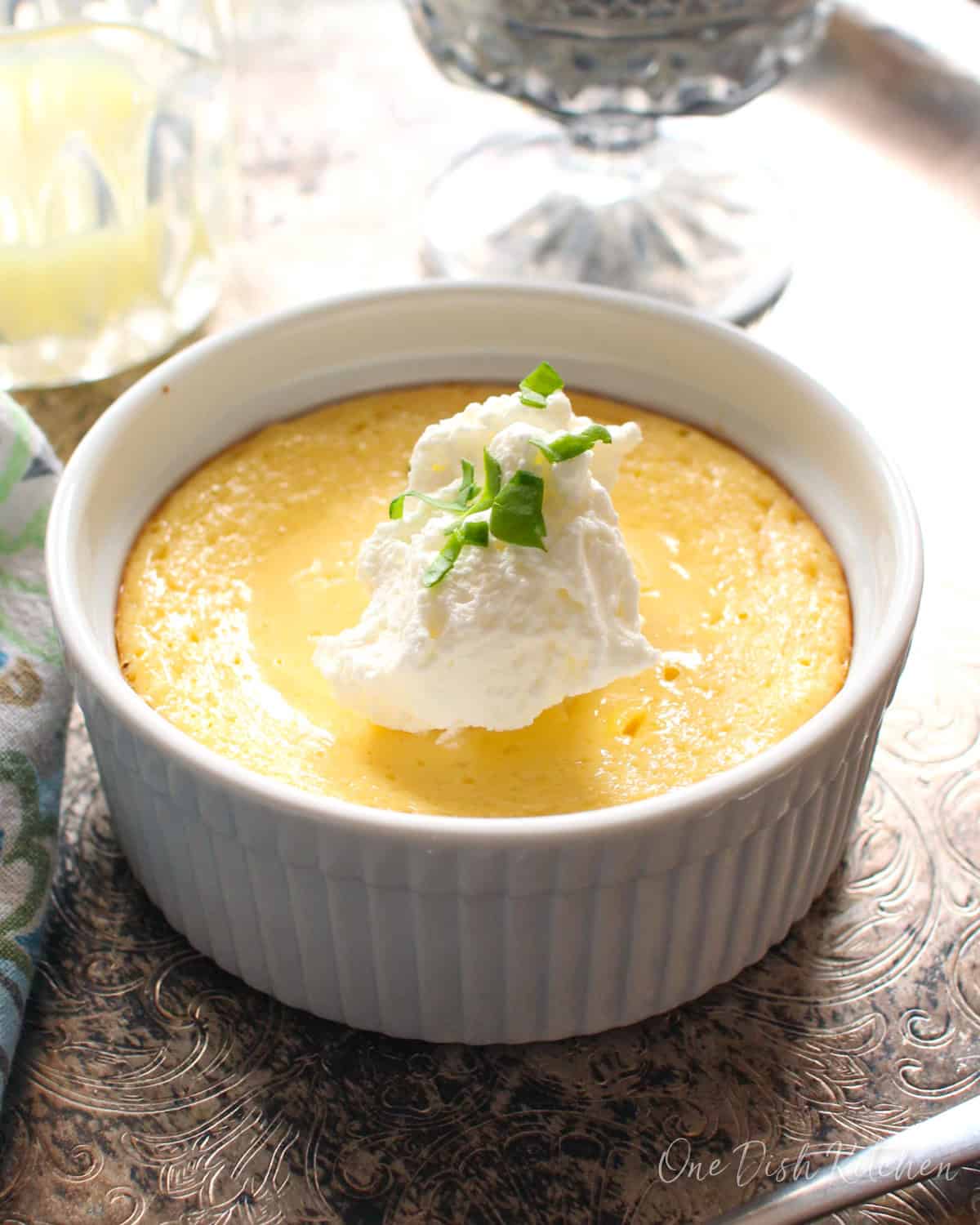a small key lime pie on a silver tray.