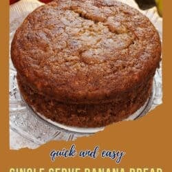 an individual banana bread baked in a ramekin on a small plate.