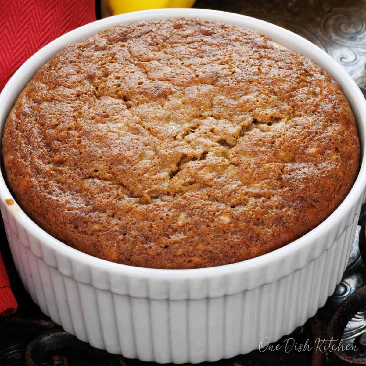 a mini banana bread in a small baking dish.