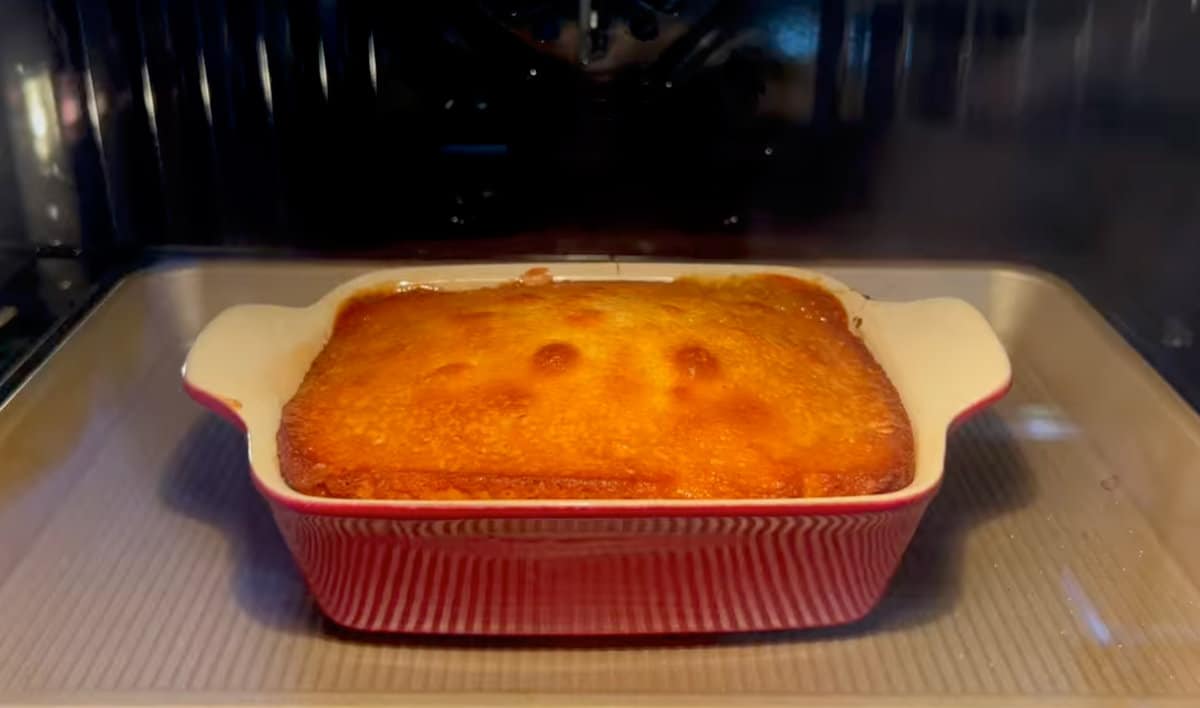 a banana upside down cake baking in the oven.