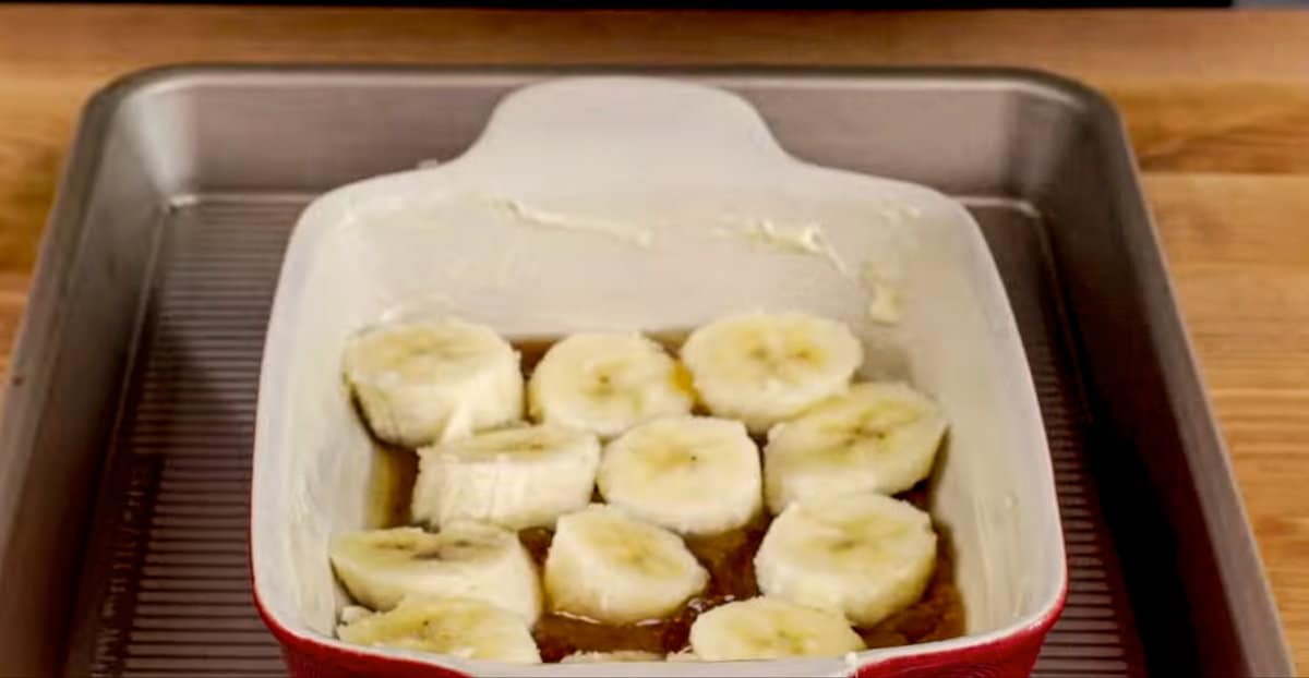 sliced bananas over melted butter and brown sugar in a small baking dish.