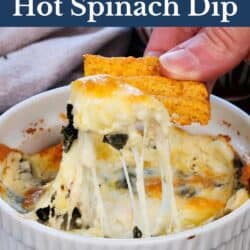 melted cheese on top of spinach dip in a ramekin.