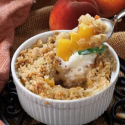 Ramekin with peach crisp with a promotional text: peach recipes made with one peach