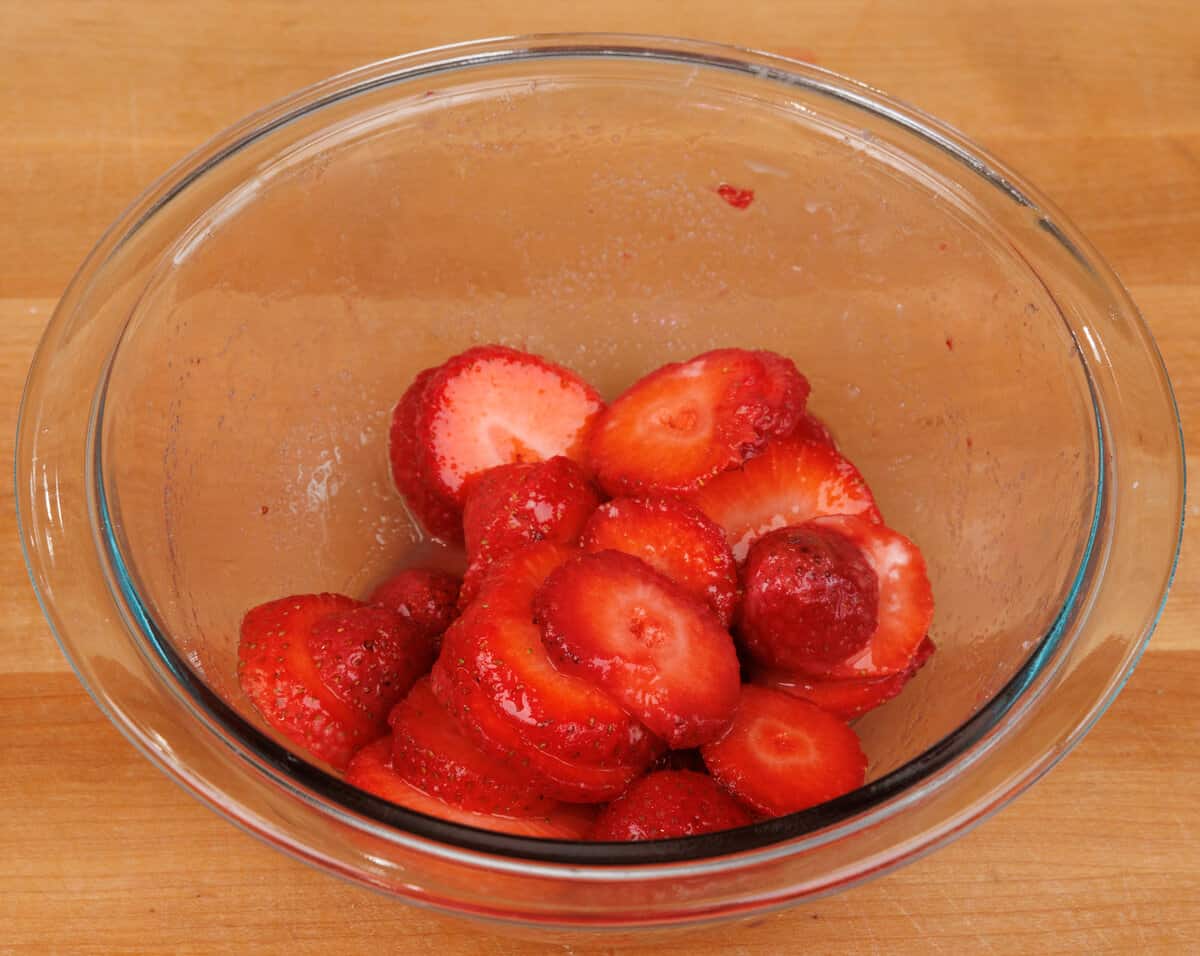 sliced strawberries and cornstarch in a bowl