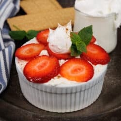 a mini icebox cake topped with strawberries on a tray