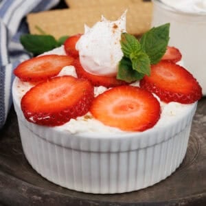 a single serve strawberry icebox cake in a white ramekin.