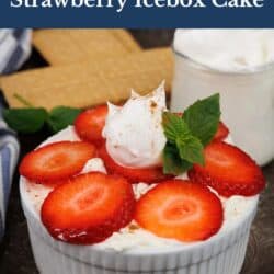a mini strawberry icebox cake in a ramekin topped with whipped cream and fresh mint.
