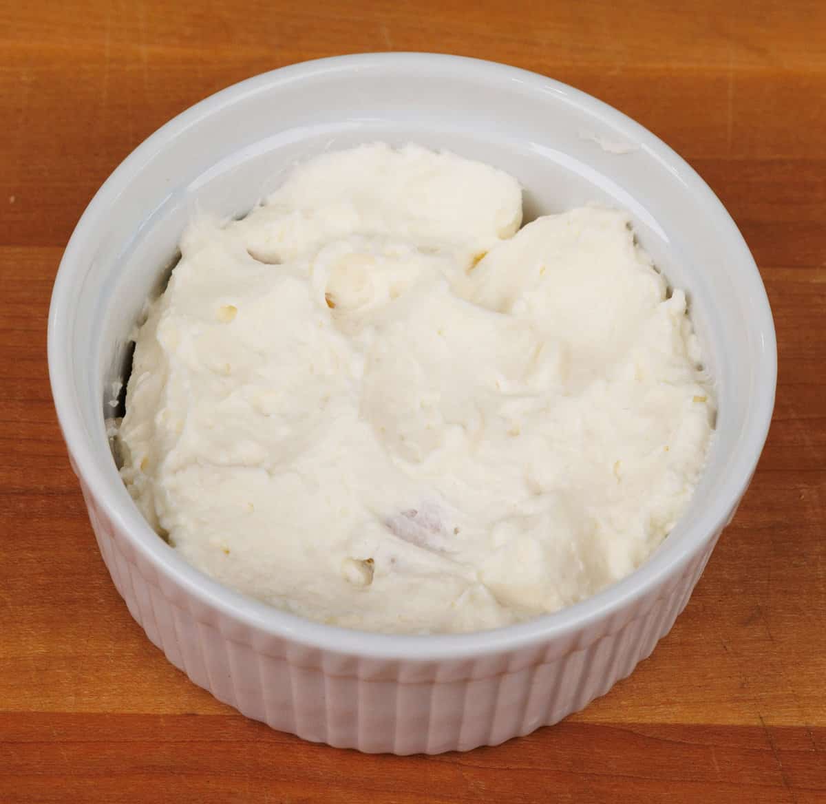 whipped cream spread across graham crackers in a small baking dish.