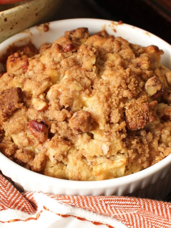 a single apple muffin in a ramekin.