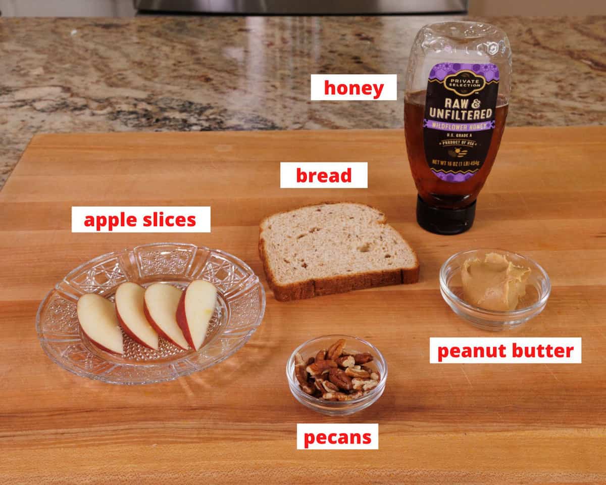 peanut butter toast ingredients on a cutting board in a kitchen