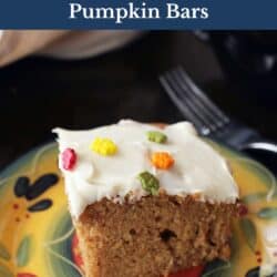 one pumpkin bar with cream cheese topping on a yellow plate.