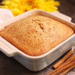 a mini spice cake in a blue baking dish.