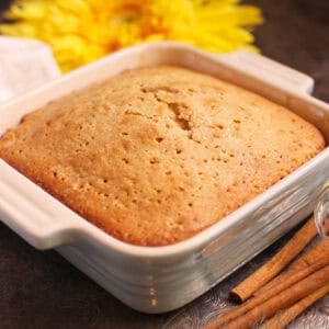 a mini spice cake in a blue baking dish.