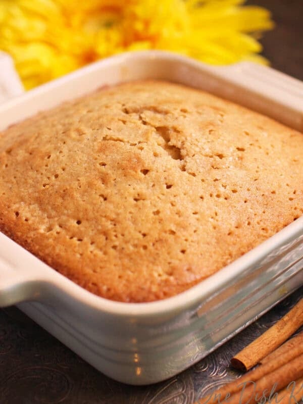 a mini spice cake in a blue baking dish.