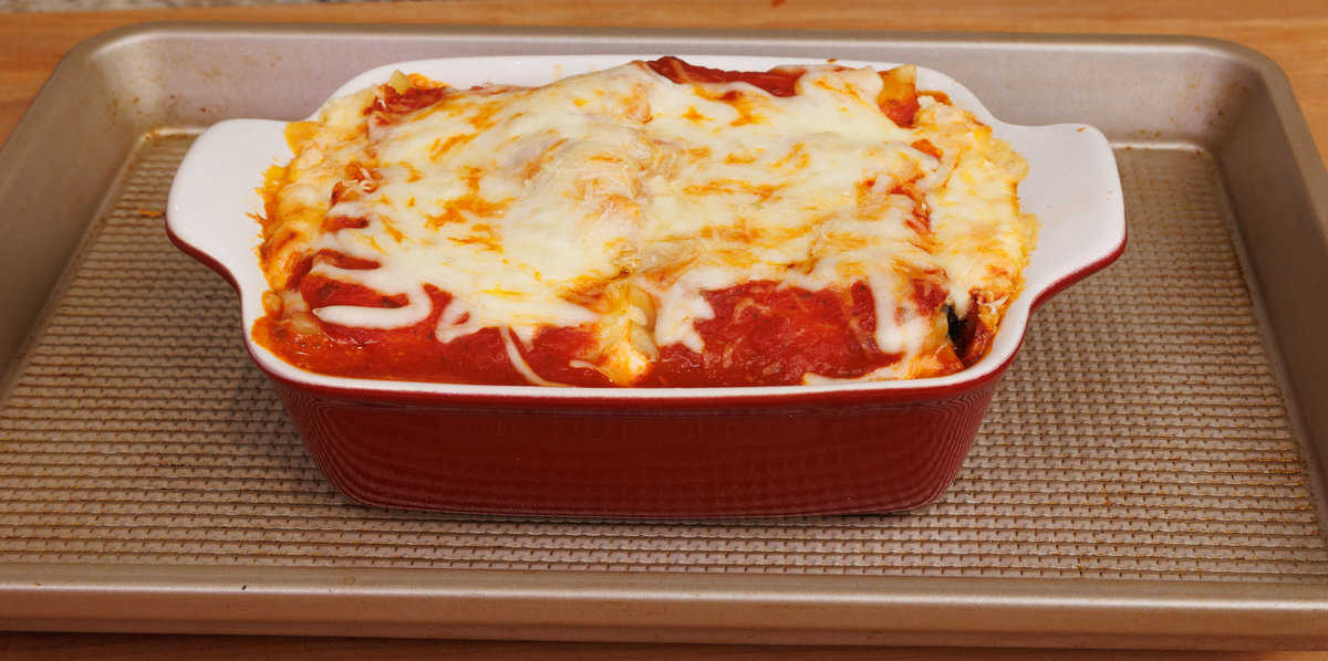a mini vegetable lasagna on a baking sheet cooling on a kitchen counter