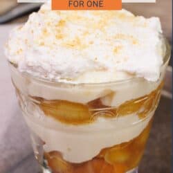 banana pudding with caramelized bananas and cookies in a dessert dish.