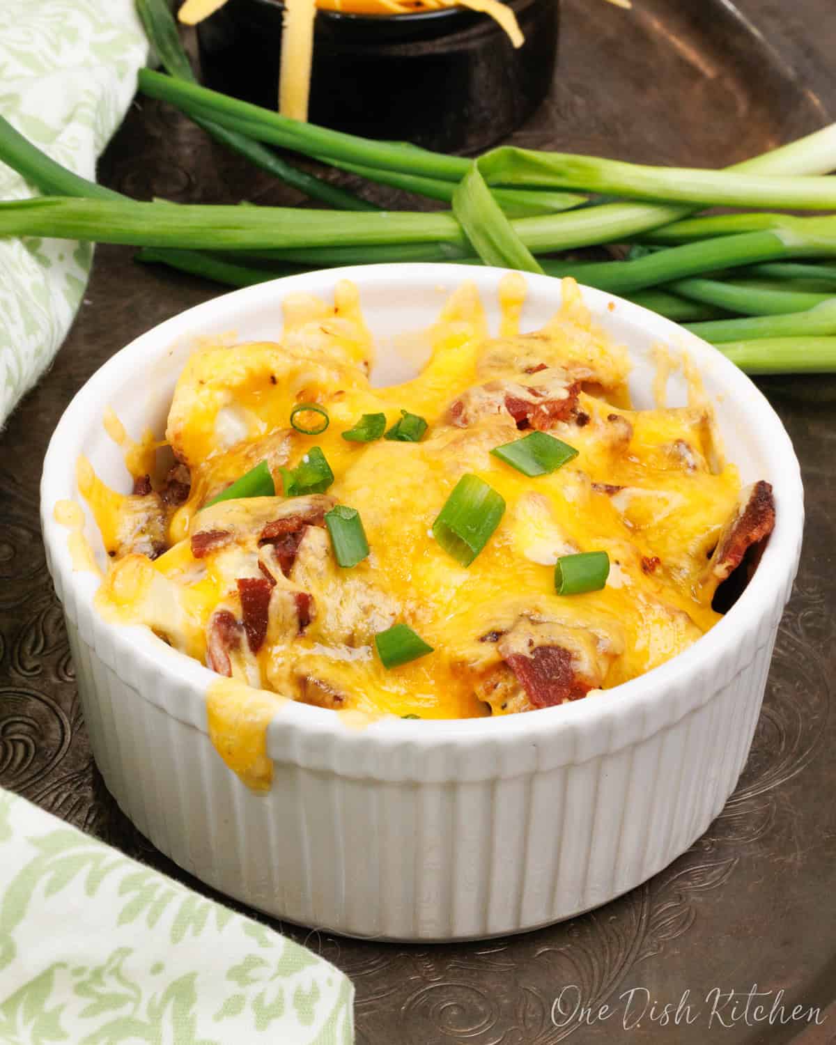 a small cauliflower casserole in a white ramekin.